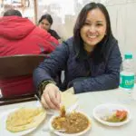 Guest enjoying chole bhature during Agra Food Tour